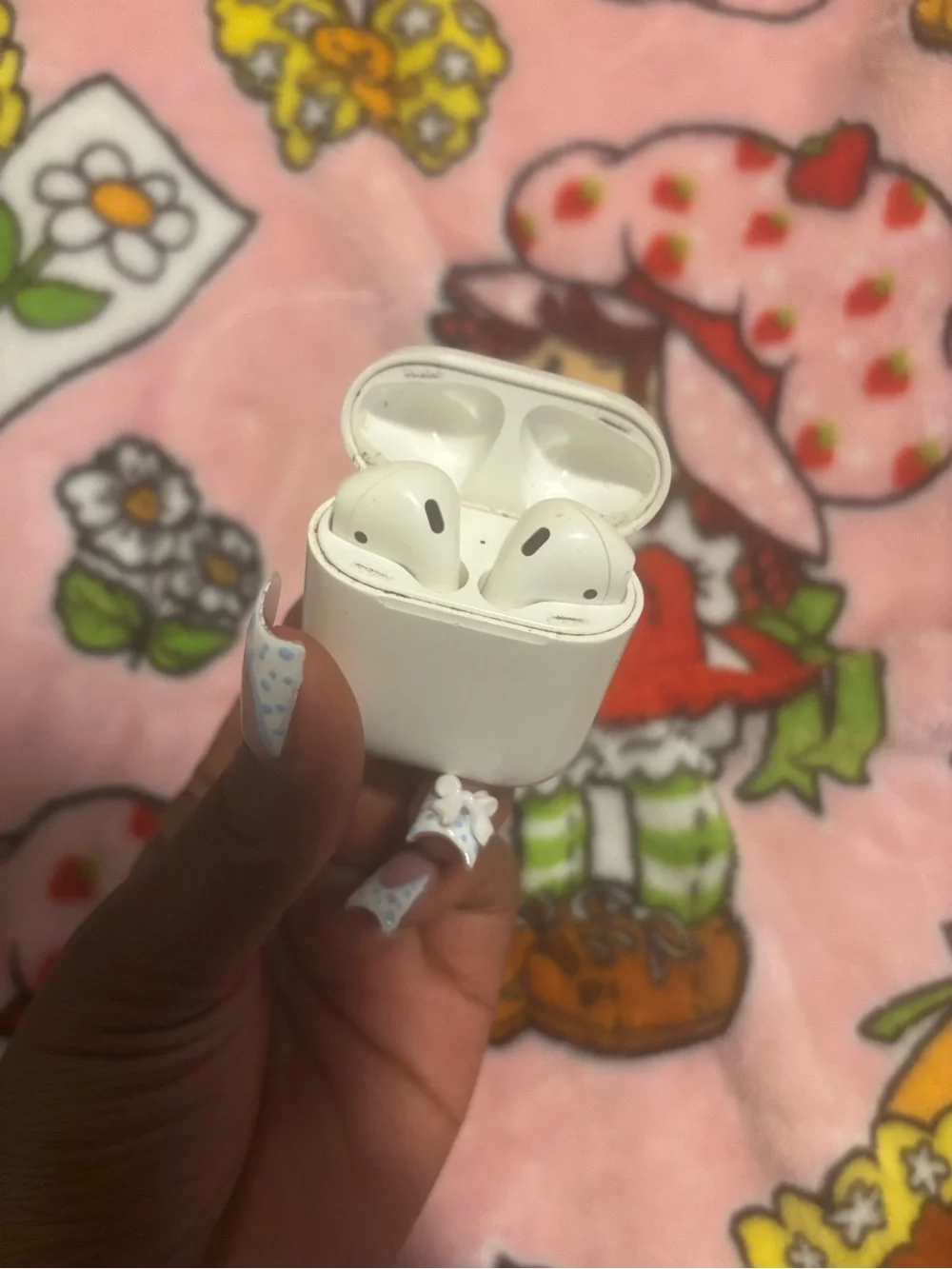 Apple White Wireless Earbud Charging Case on Pink Character Print